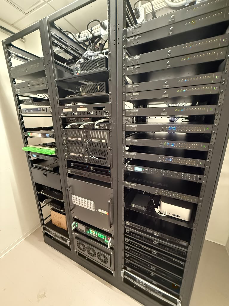 Equipment racks with network switches, amplifiers and structured cabling